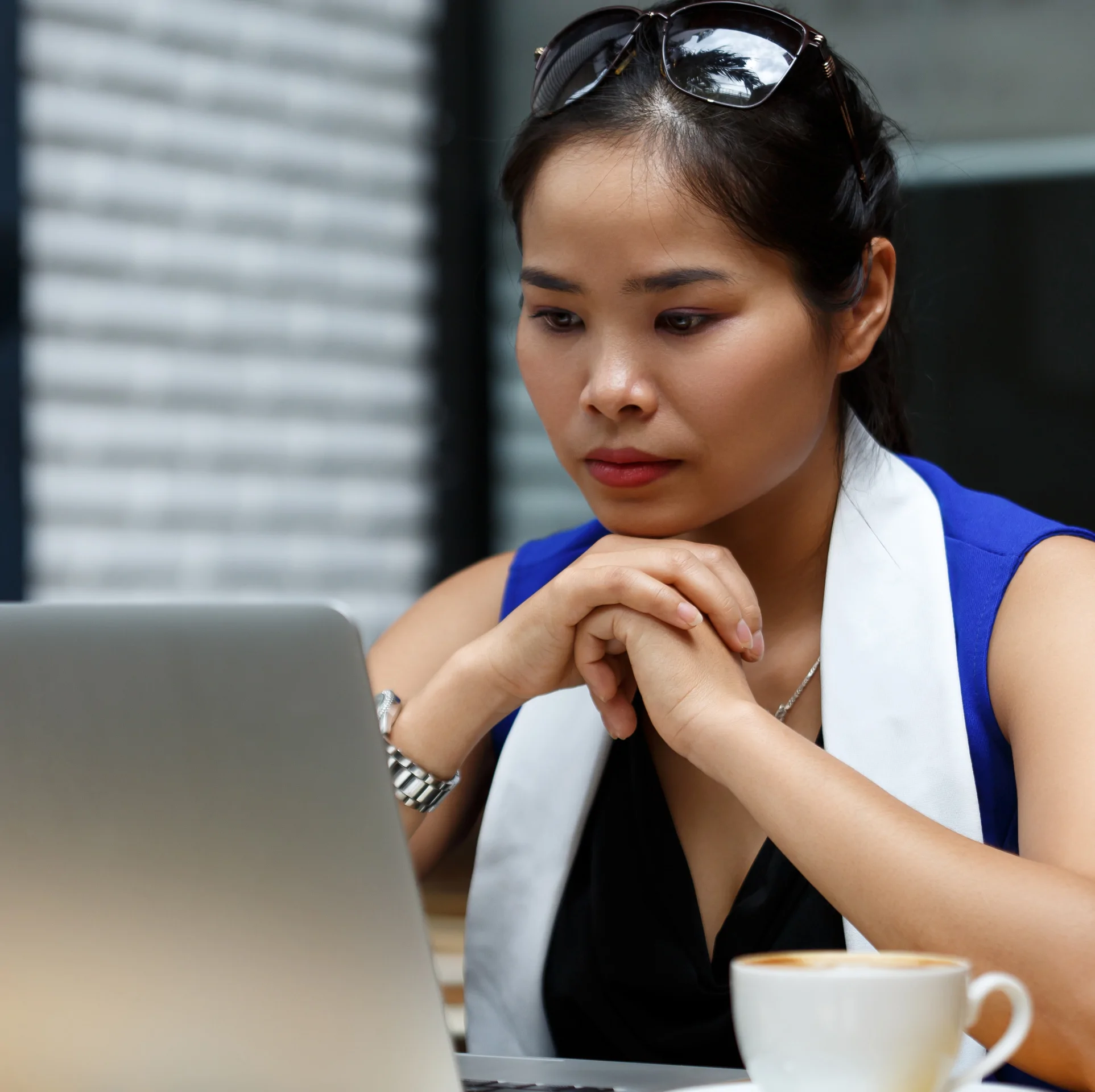 Independent Business owner working with bookkeeping records at a laptop